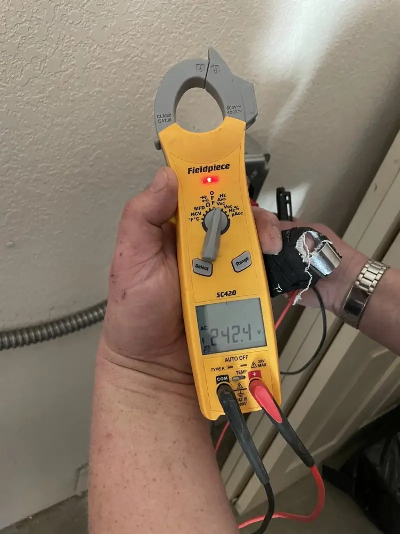 Voltage testing with clamp meter during Outlet Installation in Mundelein